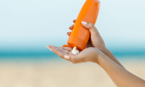woman-hand-apply-sunscreen-on-the-beach-royalty-free-image-1047792178-1556728013